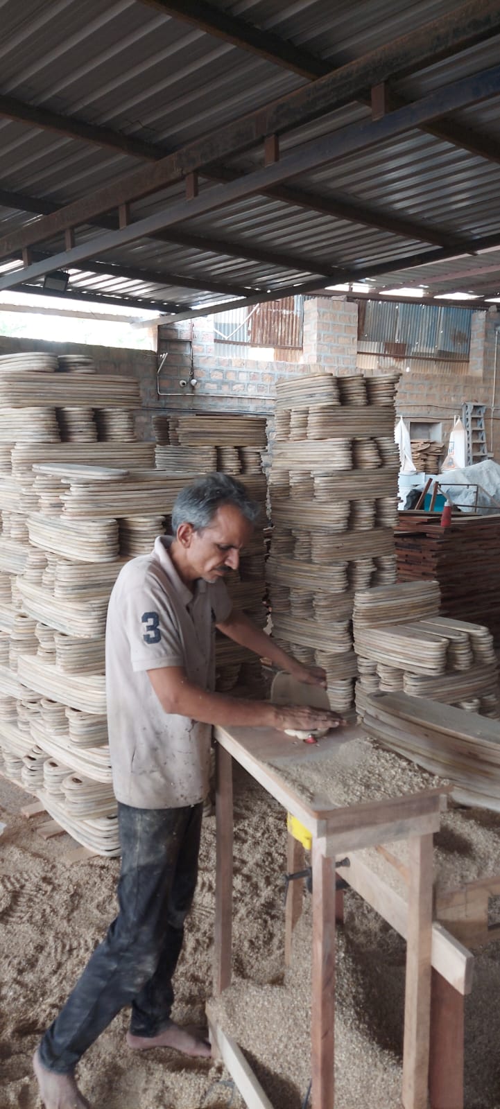 S.K. Creations artisan handcrafting wooden products in the Jodhpur workshop